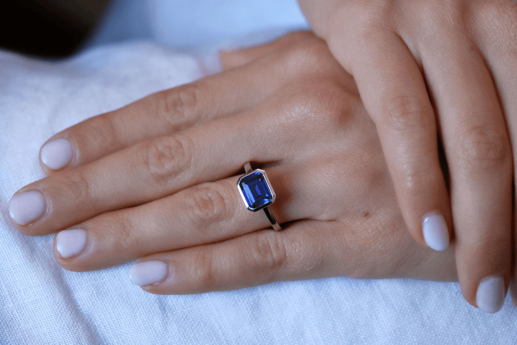 Emerald Cut Sapphire Bezel Classic Engagement Ring East West