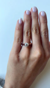Round Cut Tapered Band Engagement Ring with a Diamond Cathedral Setting